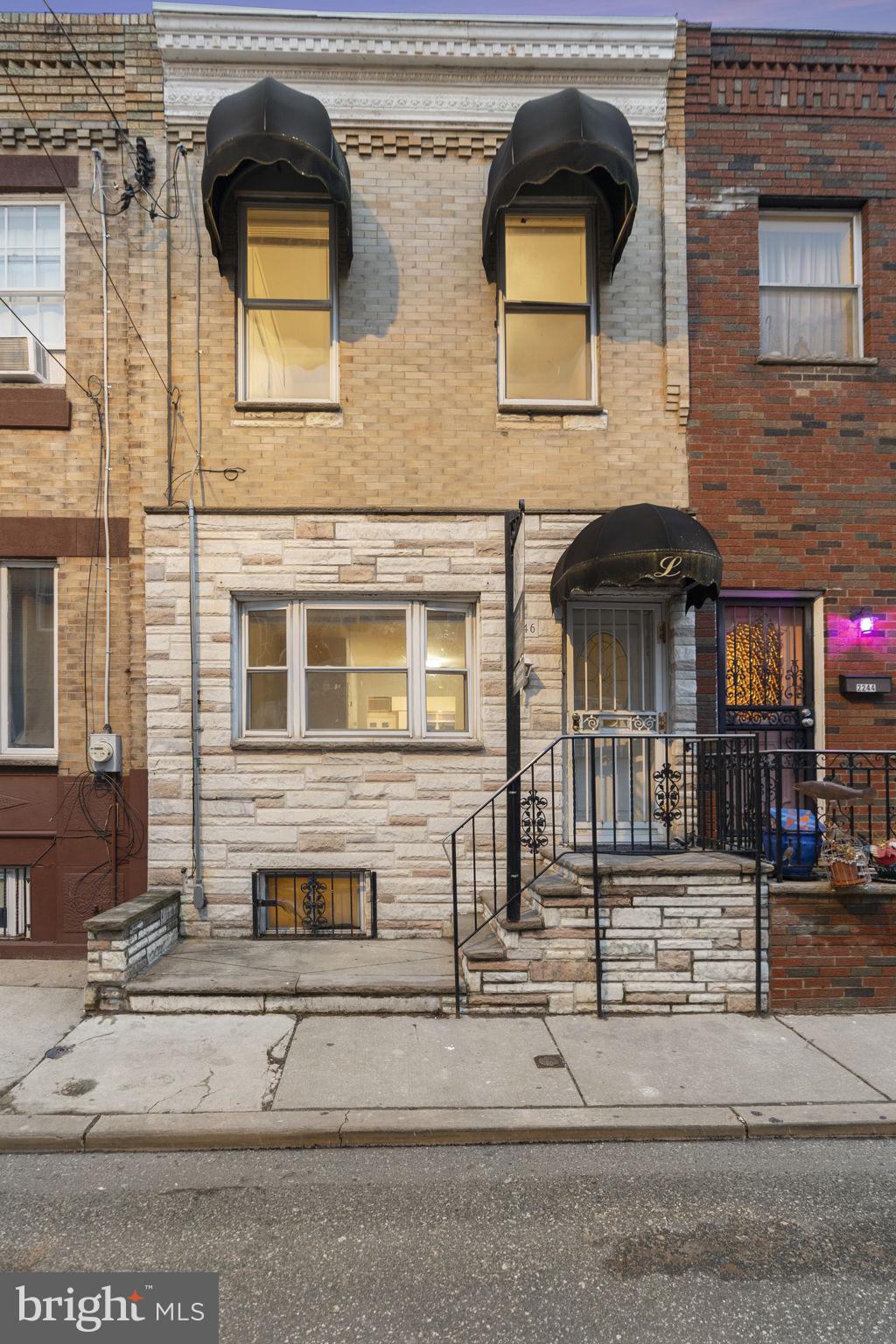 2246 South Hicks Street Philadelphia, PA 19145 - Photo 2 of 26 a front view of a house with garage