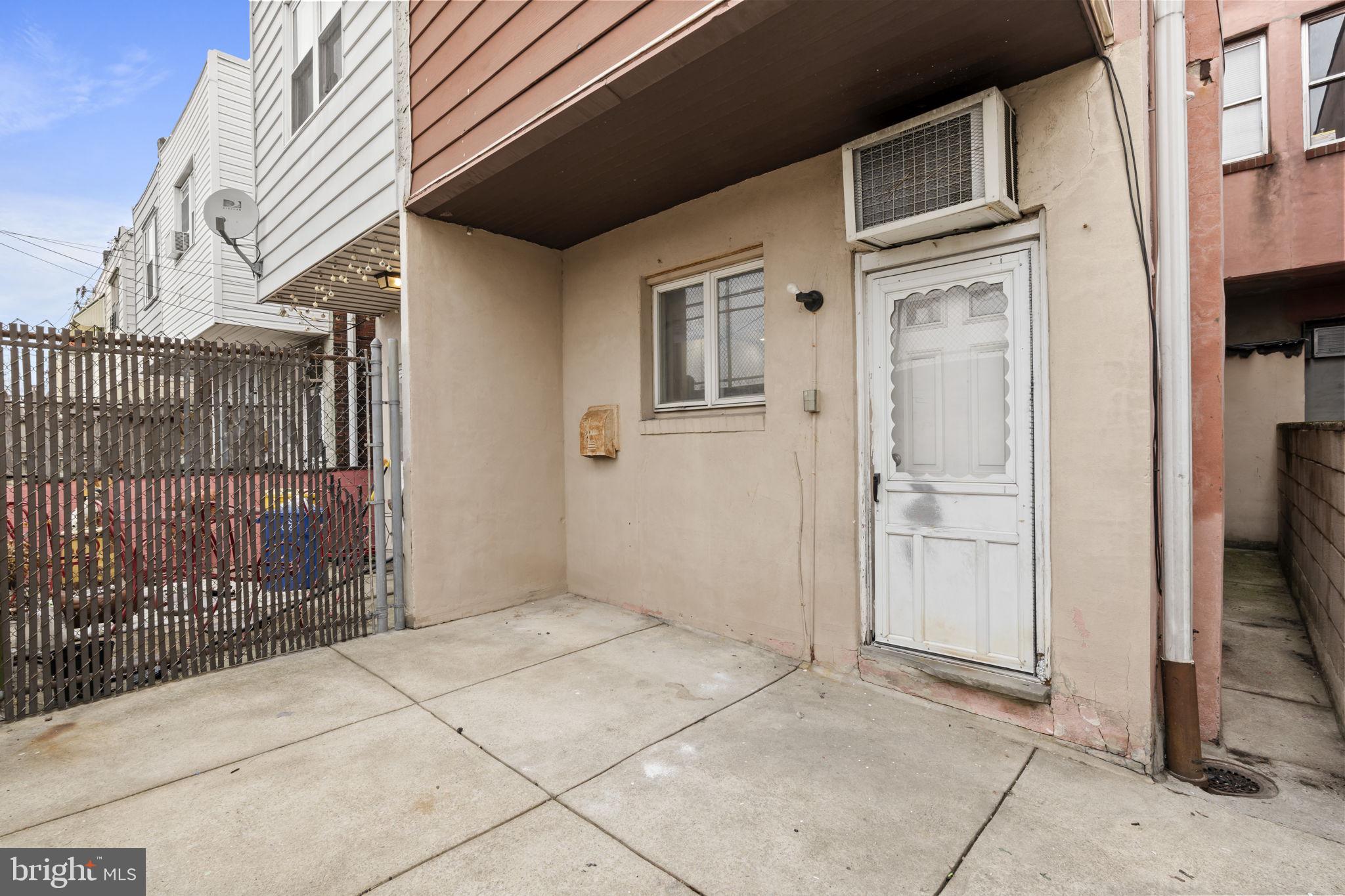 2246 South Hicks Street Philadelphia, PA 19145 - Photo 25 of 26 a view of a house with a door and wooden walls