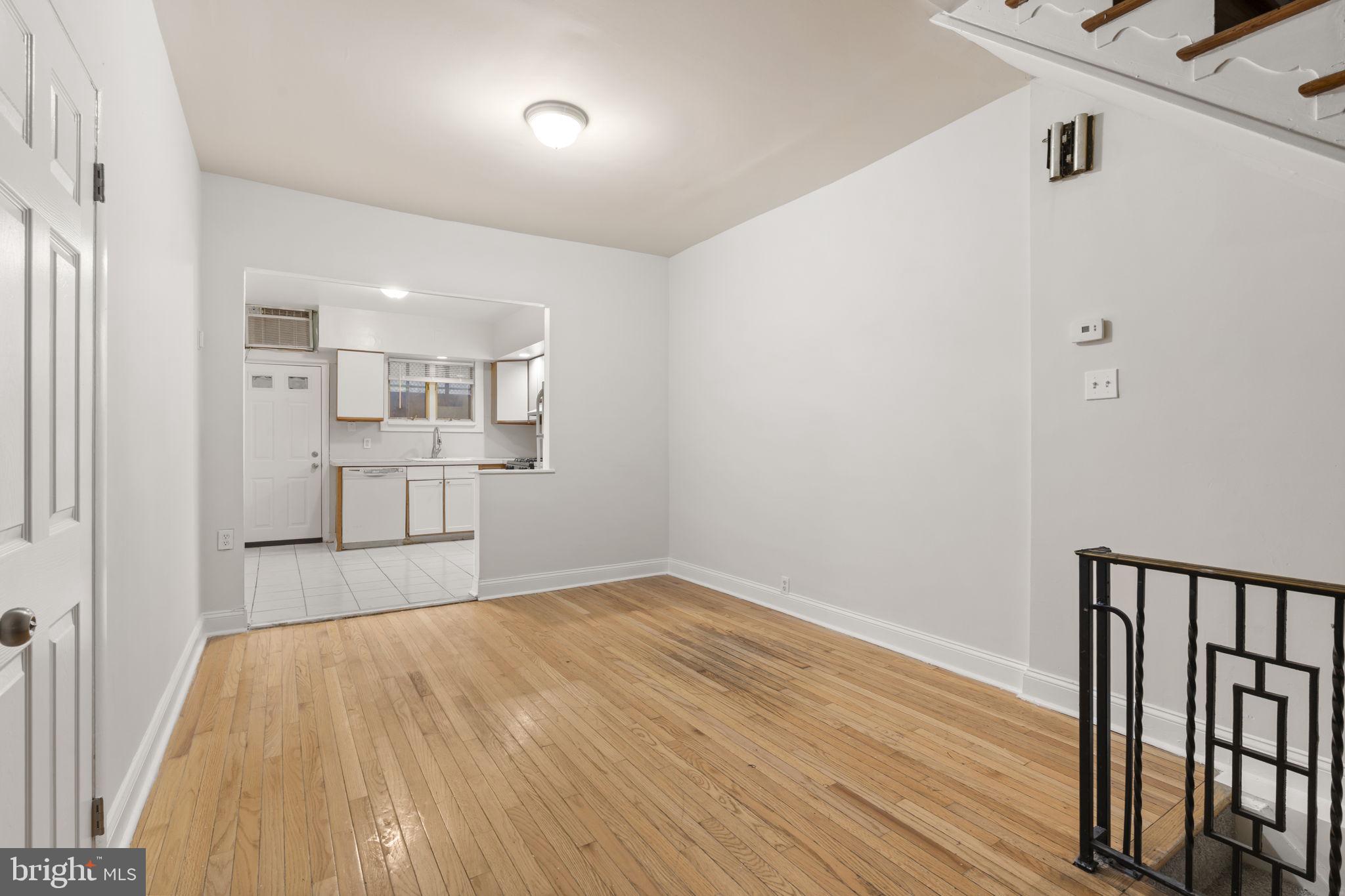 2246 South Hicks Street Philadelphia, PA 19145 - Photo 7 of 26 a view of a kitchen with wooden floor and a window