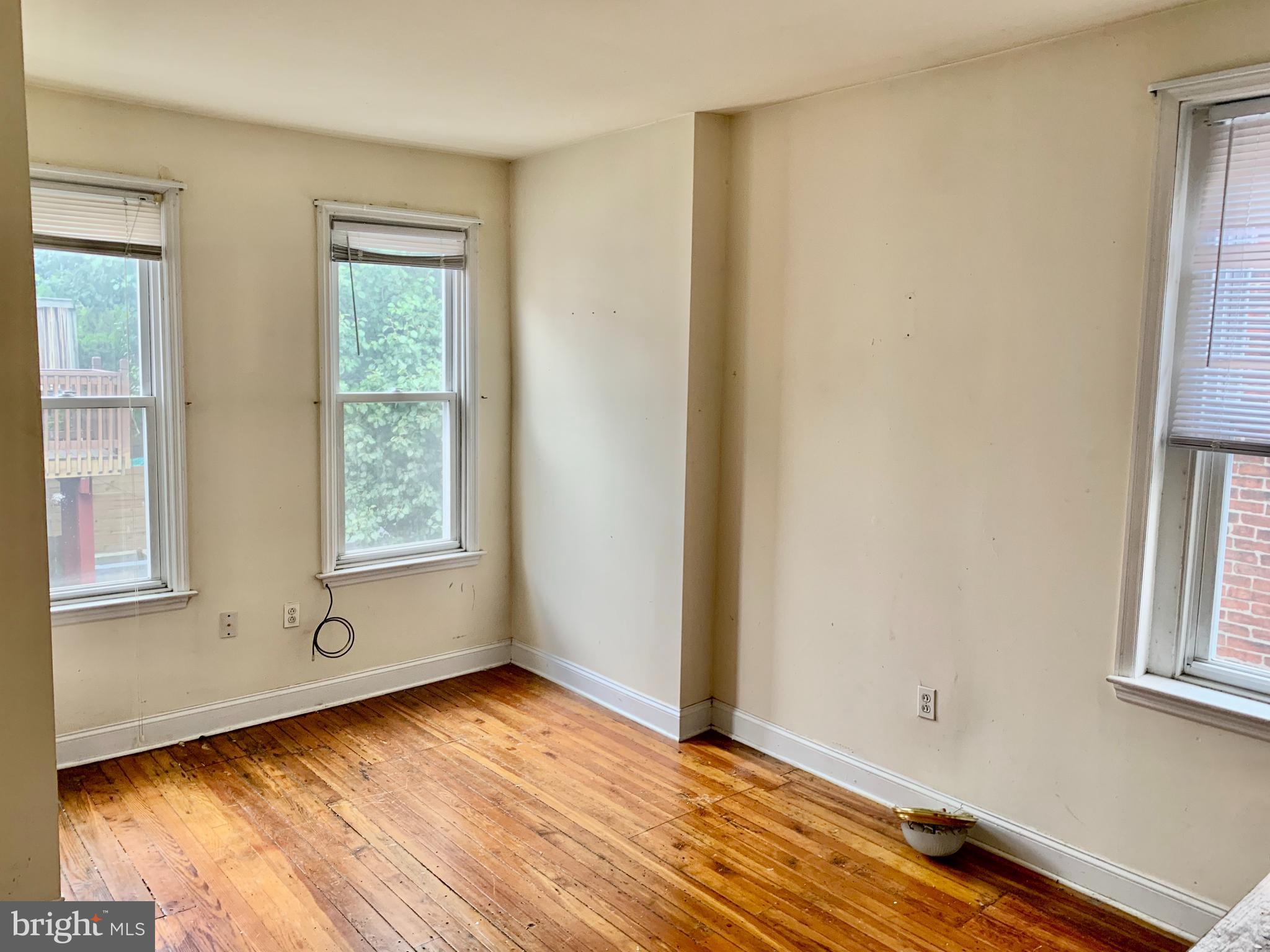 4217 Ridge Avenue, Unit 3 Philadelphia, PA 19129 - Photo 11 of 16 a view of an empty room with wooden floor and a window