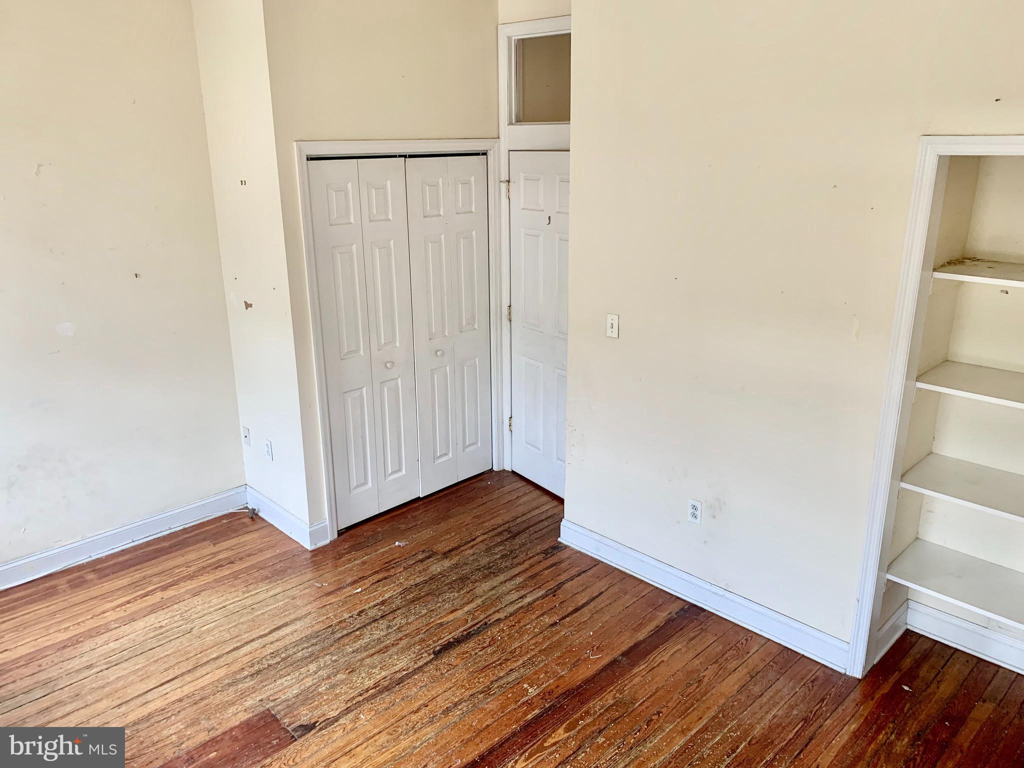 4217 Ridge Avenue, Unit 3 Philadelphia, PA 19129 - Photo 16 of 16 an empty room with wooden floor and white wall