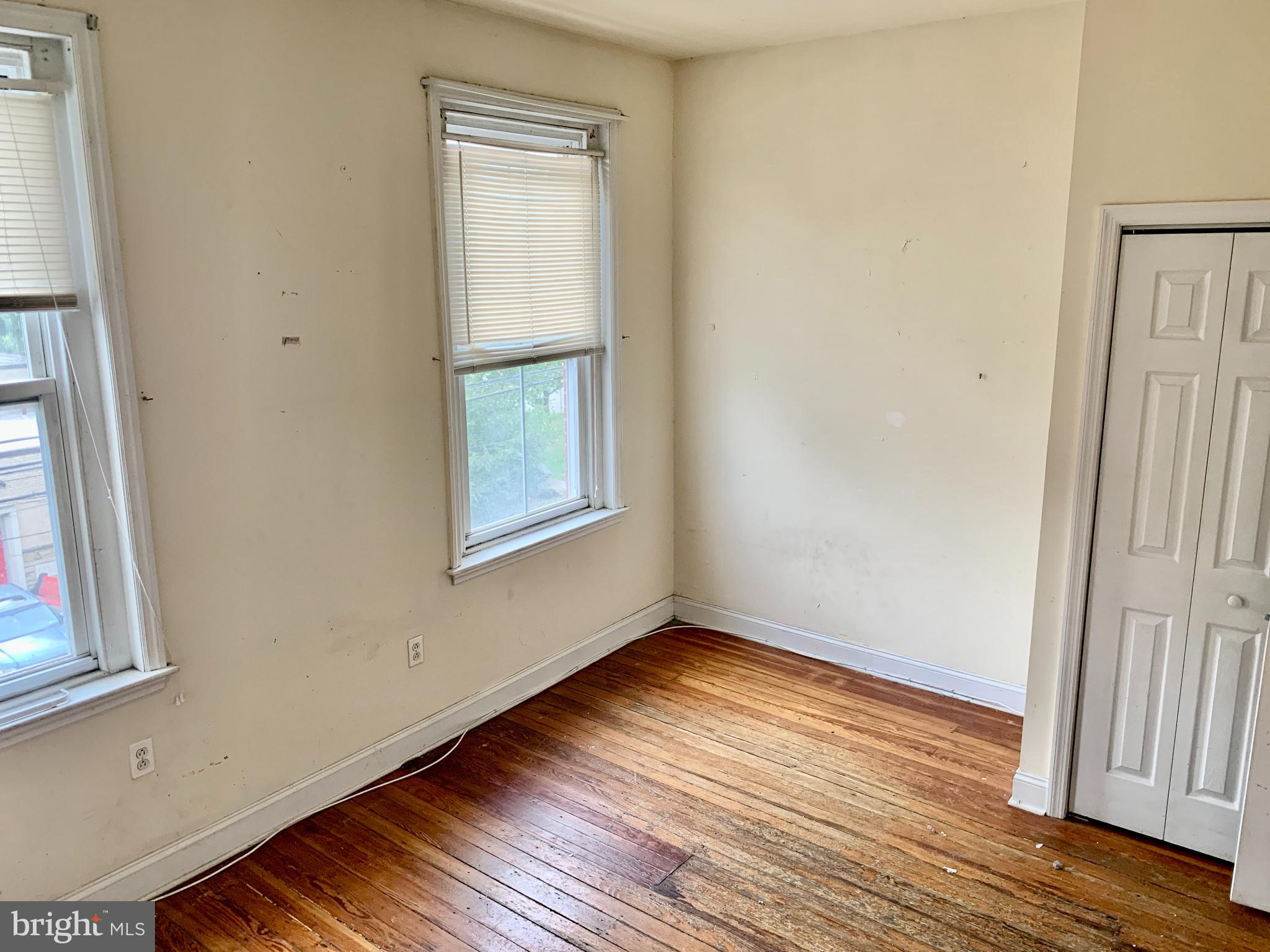 4217 Ridge Avenue, Unit 3 Philadelphia, PA 19129 - Photo 7 of 16 a view of an empty room with wooden floor and a window