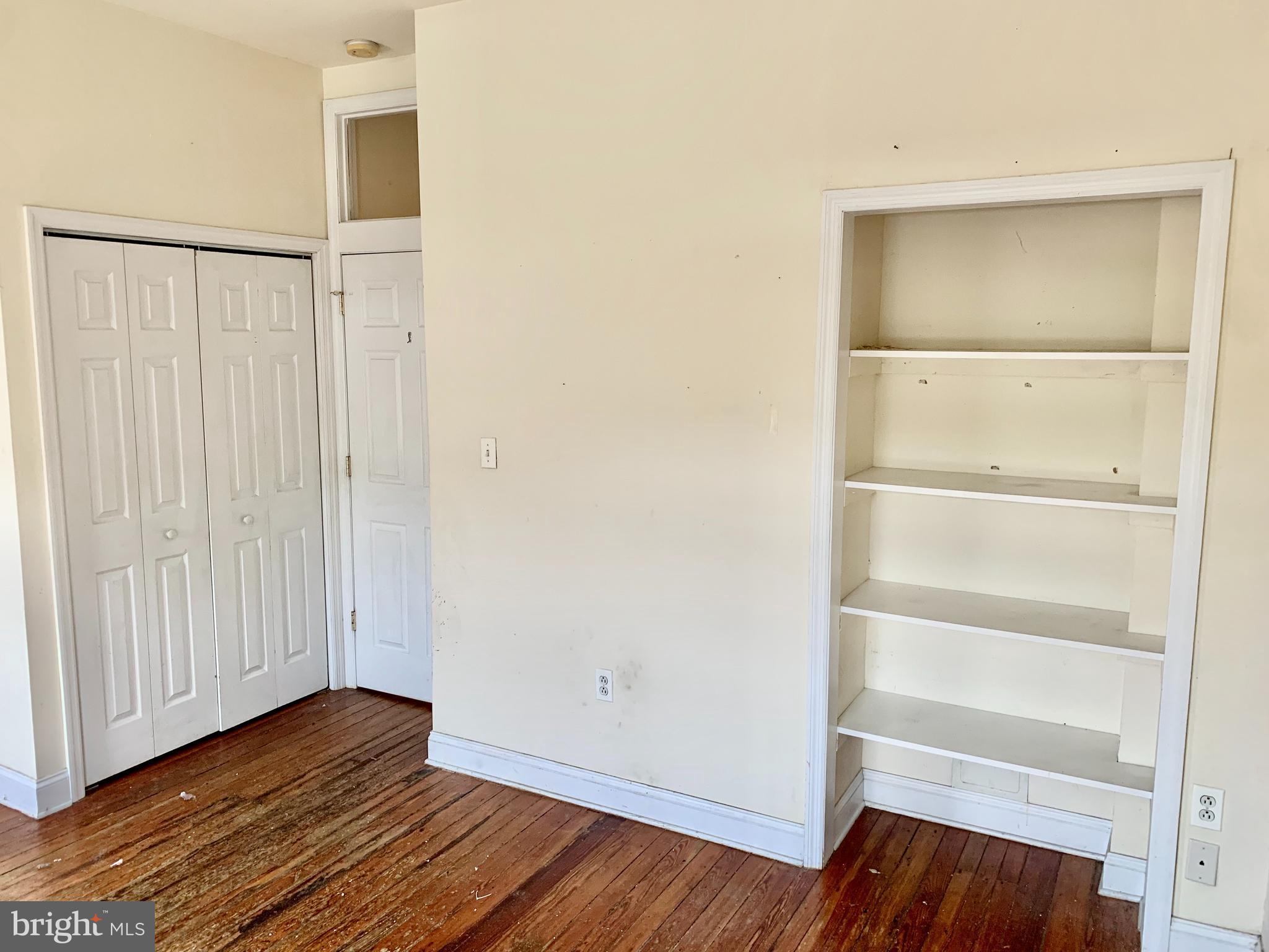 4217 Ridge Avenue, Unit 3 Philadelphia, PA 19129 - Photo 10 of 16 a view of an empty room with wooden floor and closet
