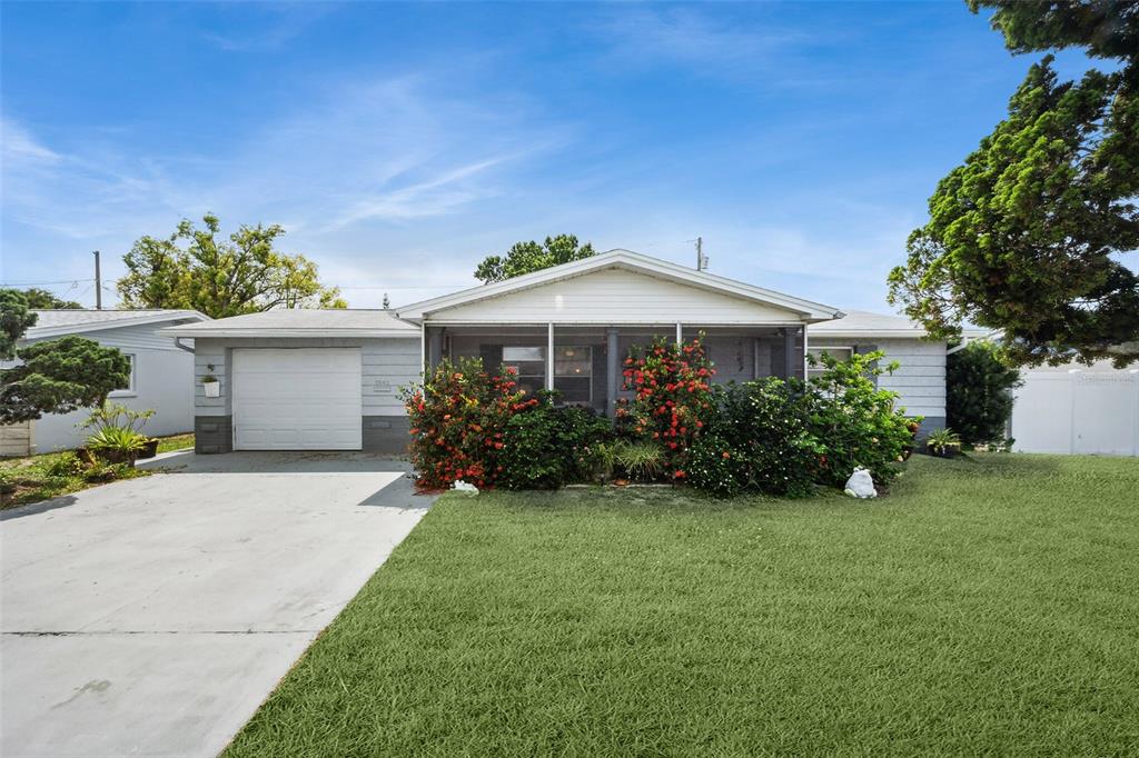 3643 Monticello Street New Port Richey, FL 34652 - Photo 1 of 1 a view of a house with a yard and sitting area