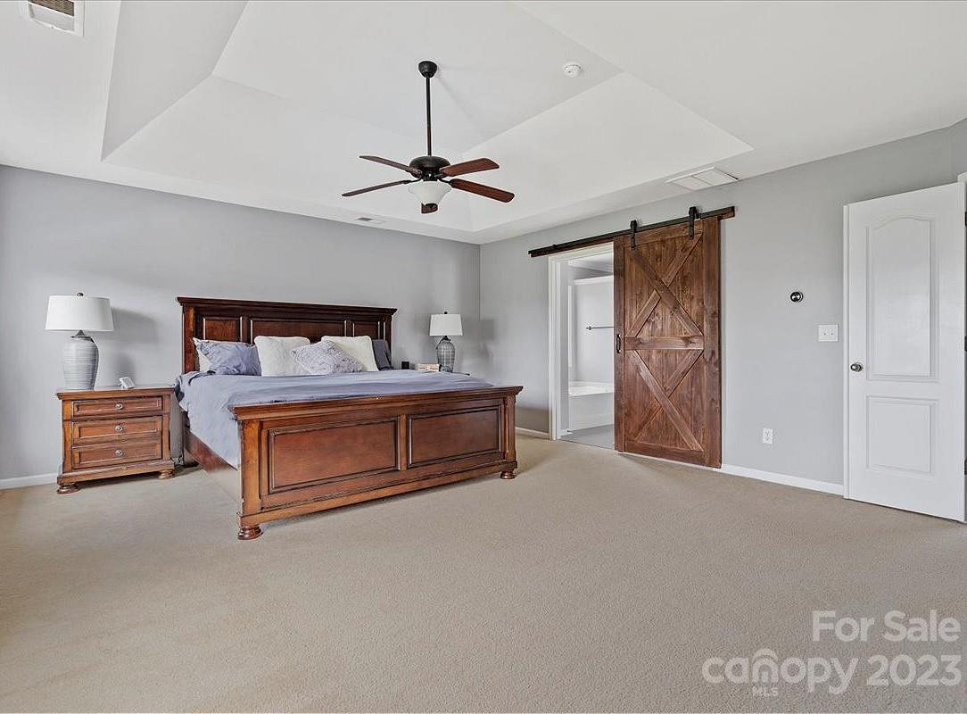 3004 Potomac Road Indian Trail, NC 28079 - Photo 11 of 31 a bedroom with furniture and a ceiling fan