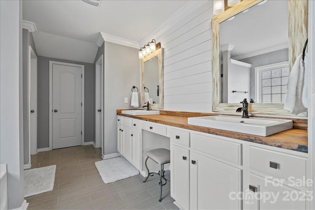 3004 Potomac Road Indian Trail, NC 28079 - Photo 13 of 31 a spacious bathroom with a double vanity sink mirror and