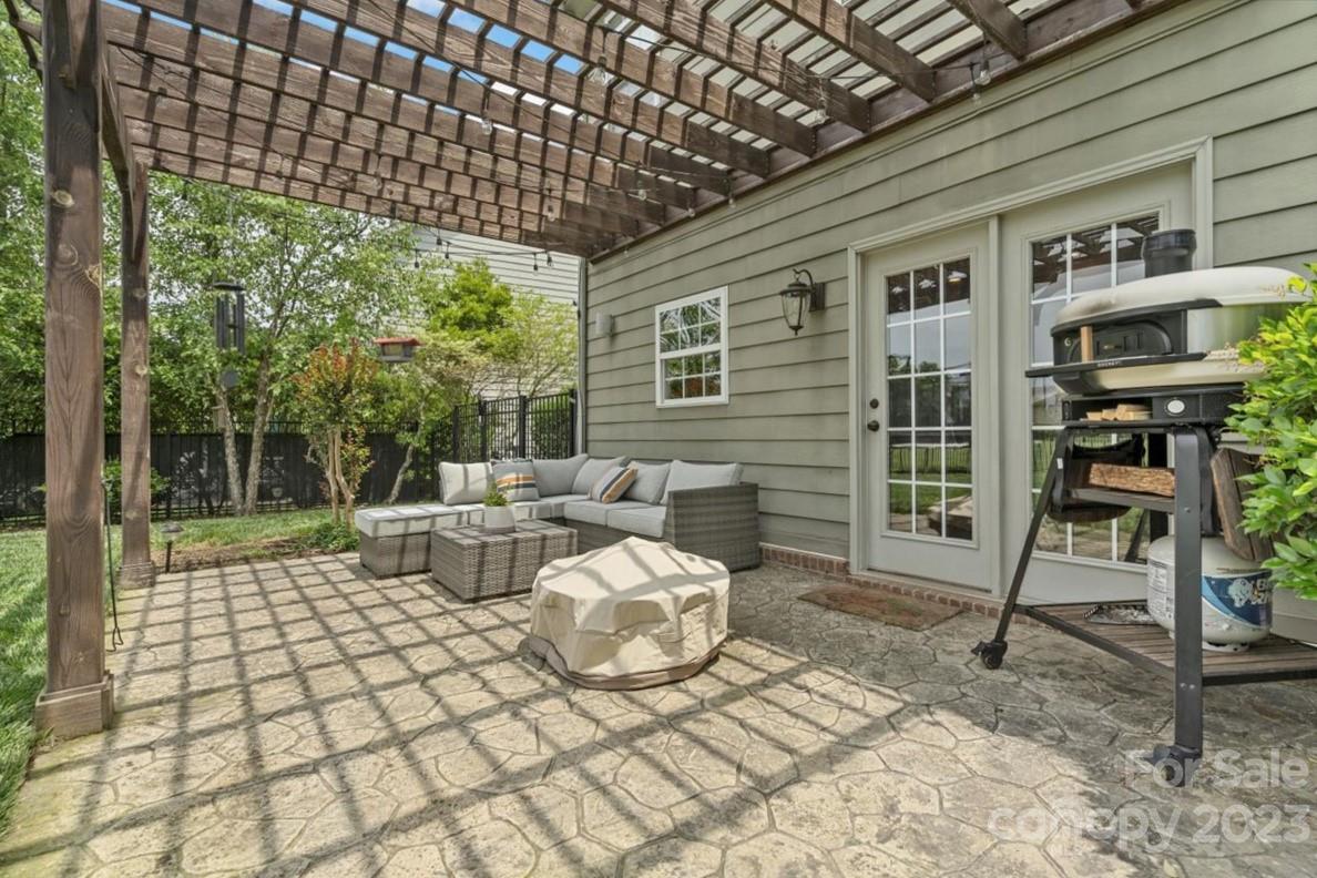 3004 Potomac Road Indian Trail, NC 28079 - Photo 18 of 31 a view of a patio with table and chairs with wooden floor and fence