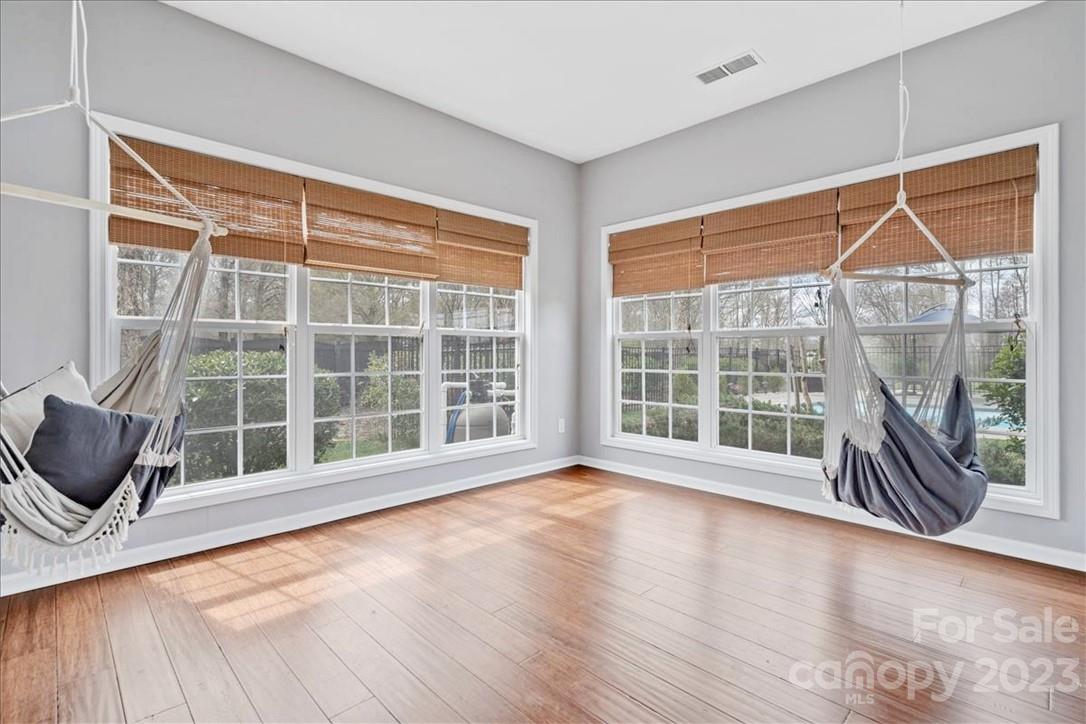 3004 Potomac Road Indian Trail, NC 28079 - Photo 10 of 31 a view of an empty room with a window and wooden floor