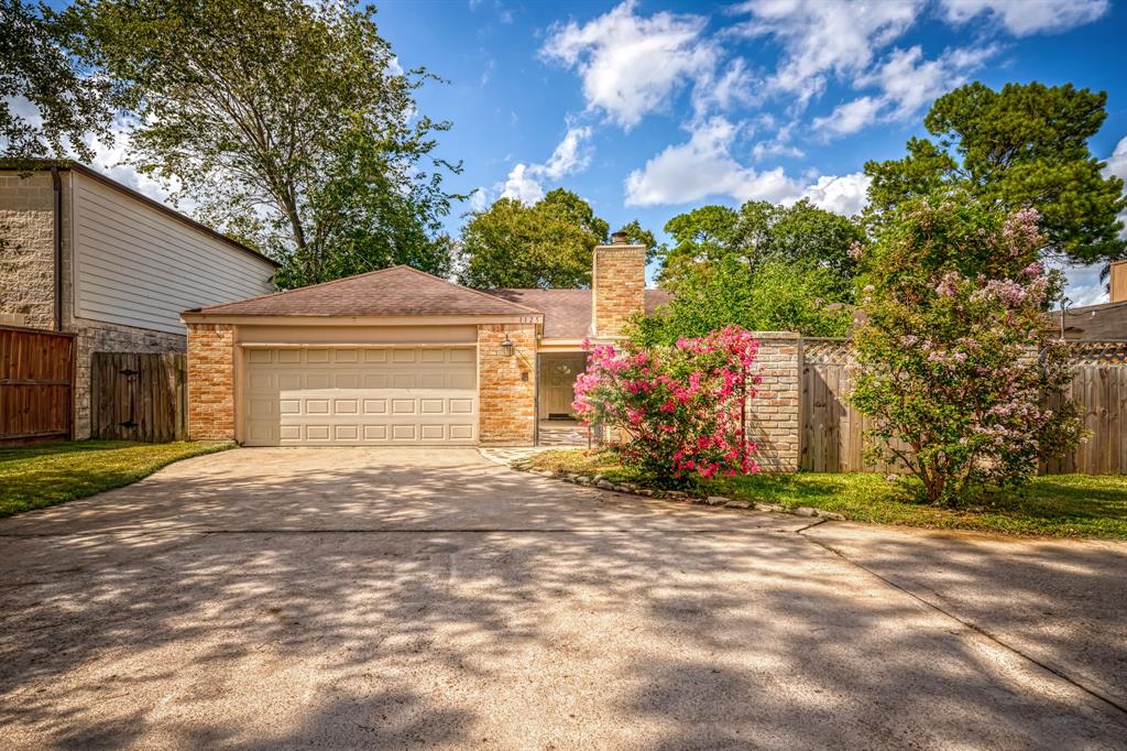 FRONT OF HOUSE W/ BEAUTIFUL CREPE MYRTLE TREES AND PLENTY OF PARKING SPACES