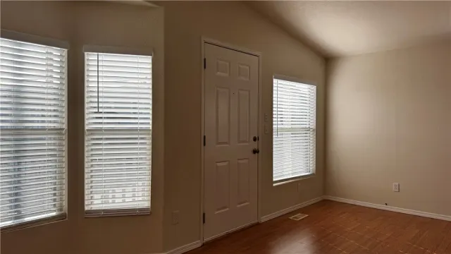 an empty room that has a window