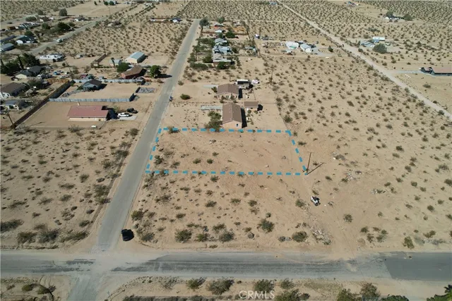 an aerial view of residential houses with parking space