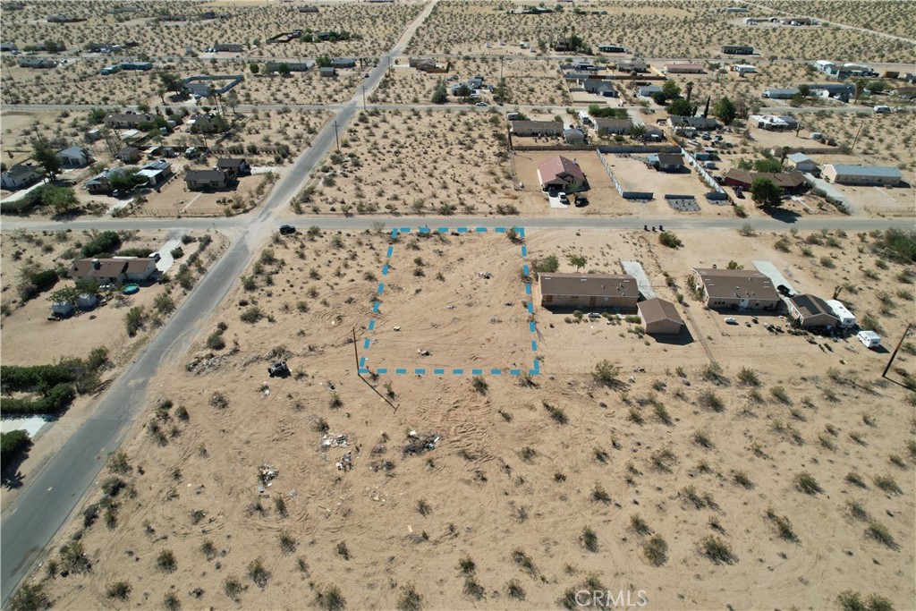 63480 Walpi Drive Joshua Tree, CA 92252 - Photo 4 of 13 an aerial view of residential houses with parking space
