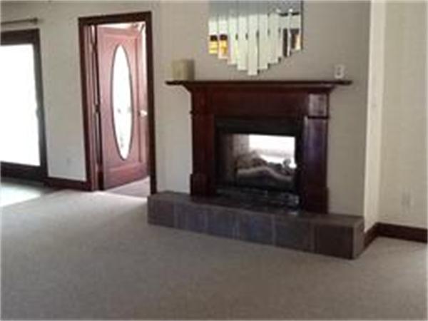 156 Marion Road Rochester, MA 02770 - Photo 9 of 23 a living room with a fireplace
