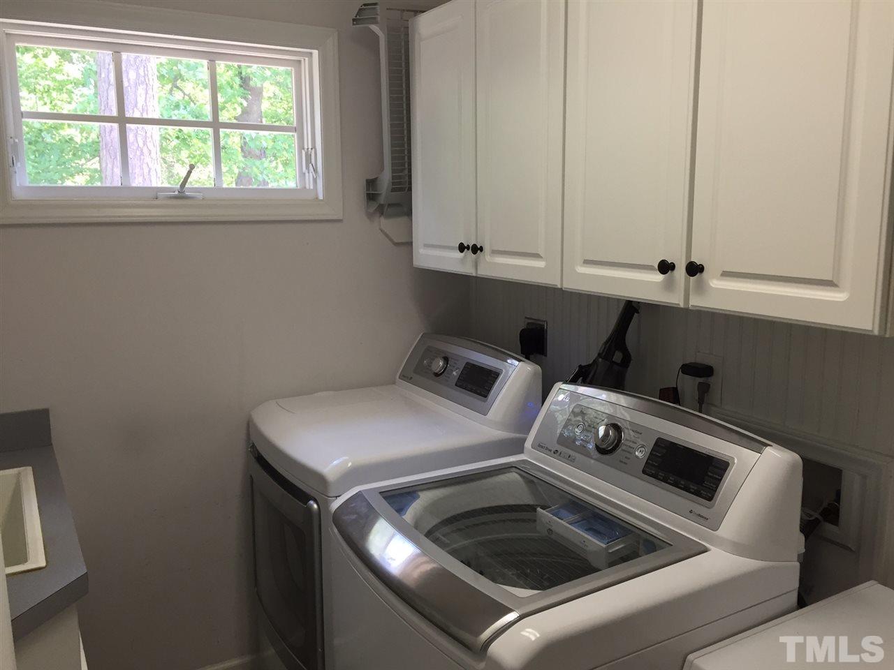 6308 Wynbrook Way Raleigh, NC 27612 - Photo 12 of 21 a utility room with dryer and washer