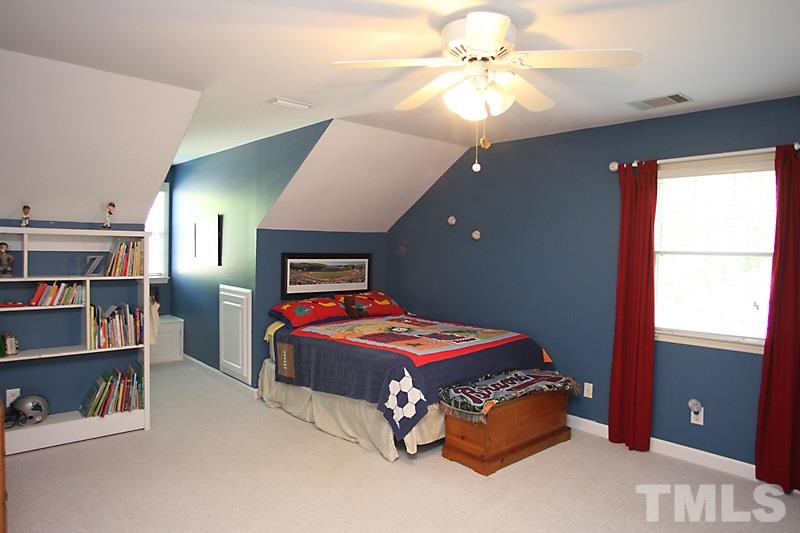 6308 Wynbrook Way Raleigh, NC 27612 - Photo 17 of 21 a bedroom with a bed and closet