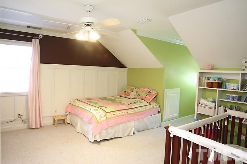 6308 Wynbrook Way Raleigh, NC 27612 - Photo 18 of 21 a bedroom with two beds and a window