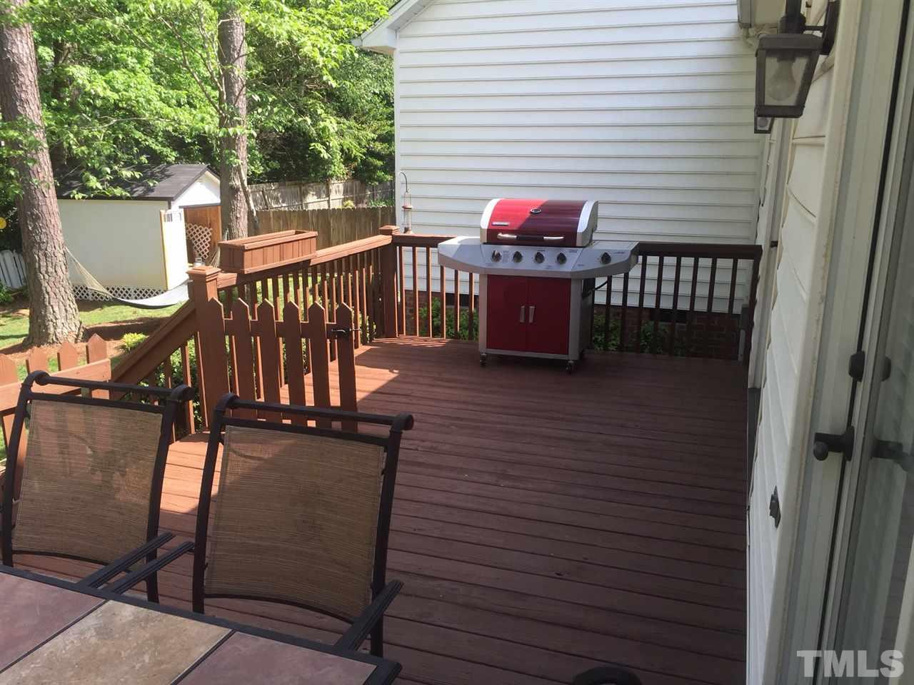 6308 Wynbrook Way Raleigh, NC 27612 - Photo 19 of 21 a view of a chairs on the deck