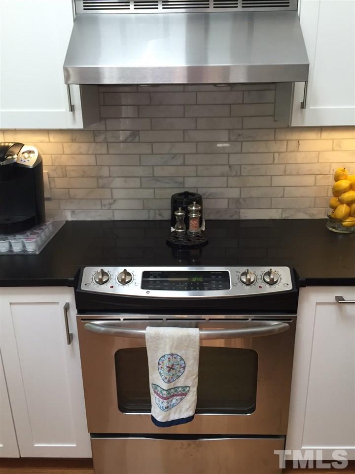 6308 Wynbrook Way Raleigh, NC 27612 - Photo 3 of 21 a close view of stove sitting inside of a house