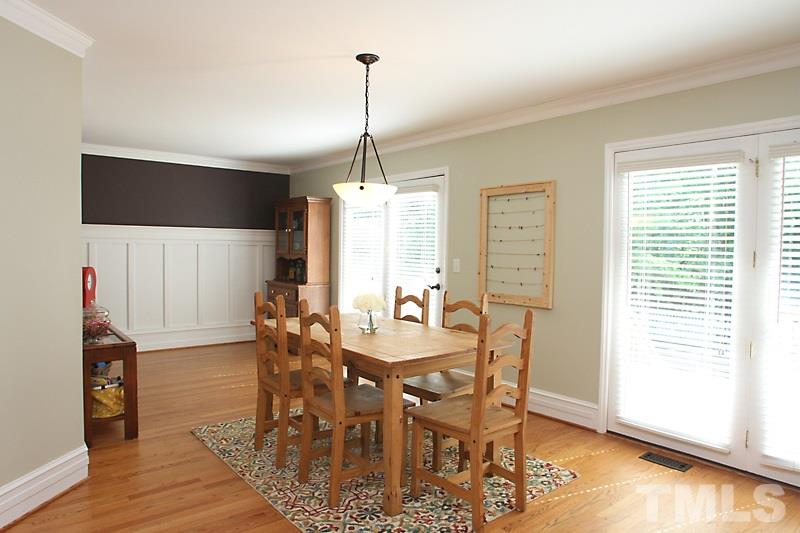 6308 Wynbrook Way Raleigh, NC 27612 - Photo 4 of 21 a view of a dining room with furniture window and wooden floor