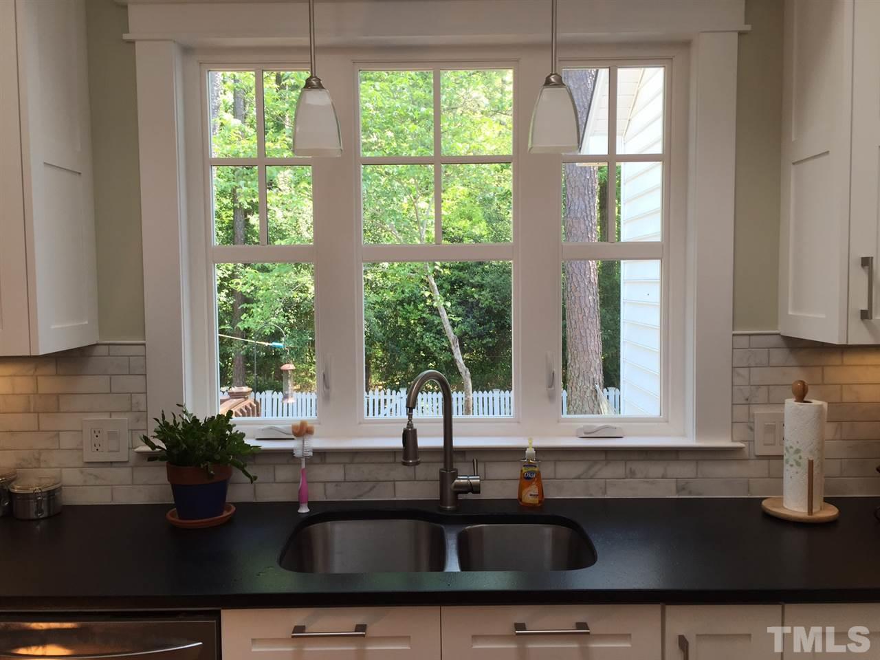 6308 Wynbrook Way Raleigh, NC 27612 - Photo 7 of 21 a kitchen with a sink and a window