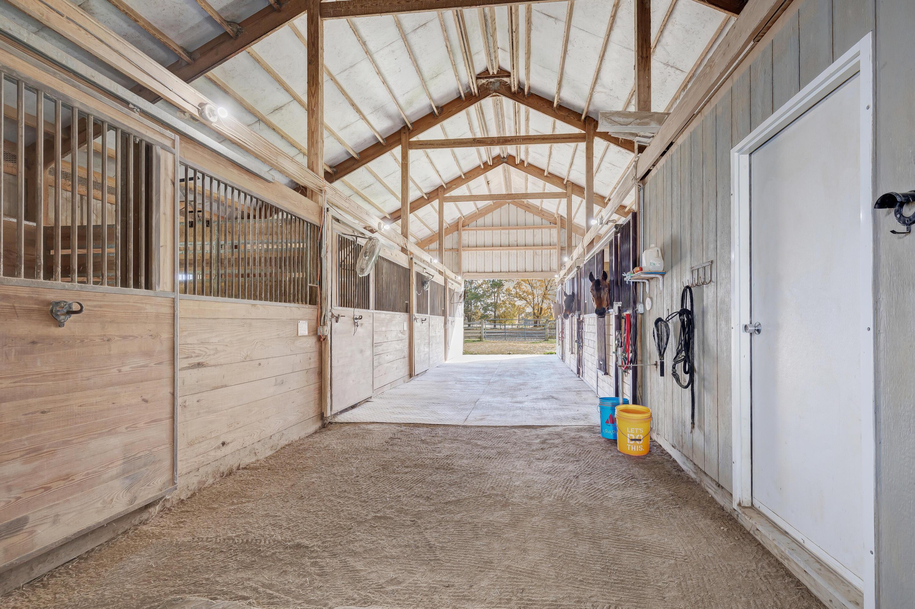 6681 Harlem Road Westerville, OH 43082 - Photo 54 of 78 • Hay storage holds ~ 600-700 bales of hay • Wood planked walls & ceilings • (9) 12’ x 12’ salls • Morton barn addition ~ 1997 • Floor mats remain • 2 interior water hydrants