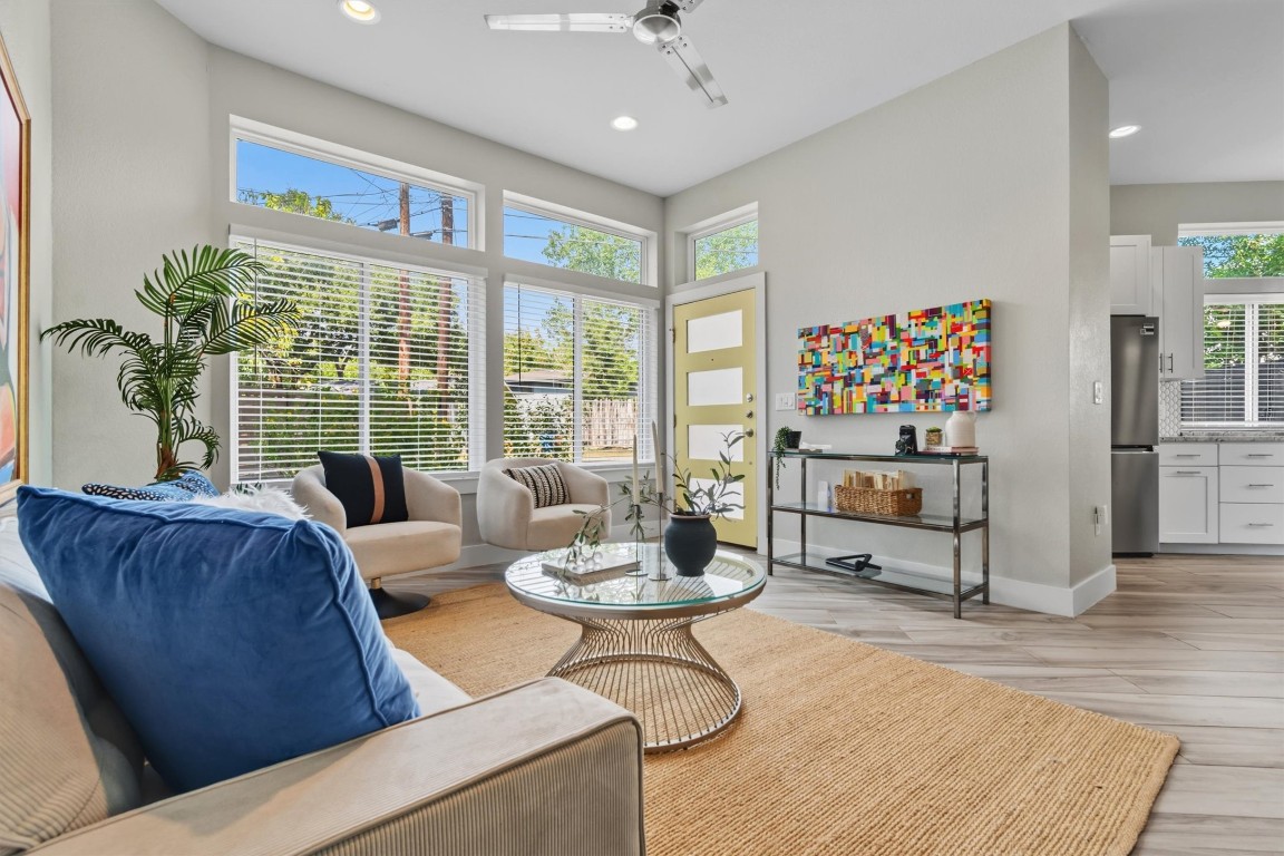 5609 Tura Lane, Unit A Austin, TX 78721 - Photo 2 of 39 a living room with furniture and a large window