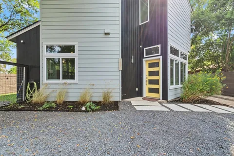 a front view of a house with garden