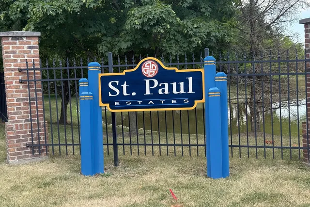 a view of a wooden fence and a pot
