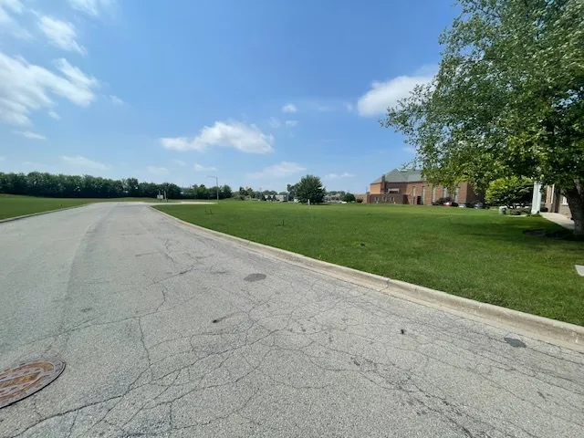 a view of a lake with a big yard