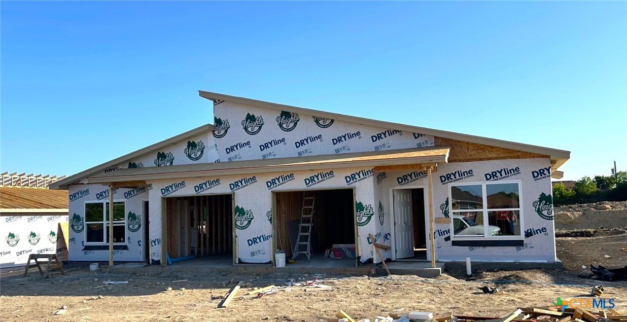a front view of a house with outdoor seating