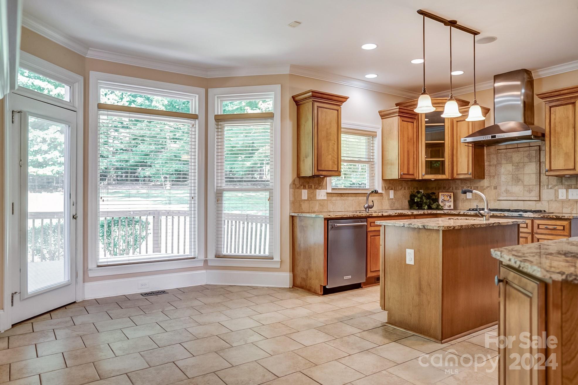 693 Normandy Road Mooresville, NC 28117 - Photo 17 of 48 a view of a kitchen with kitchen island granite countertop a large counter top space a sink stainless steel appliances and cabinets