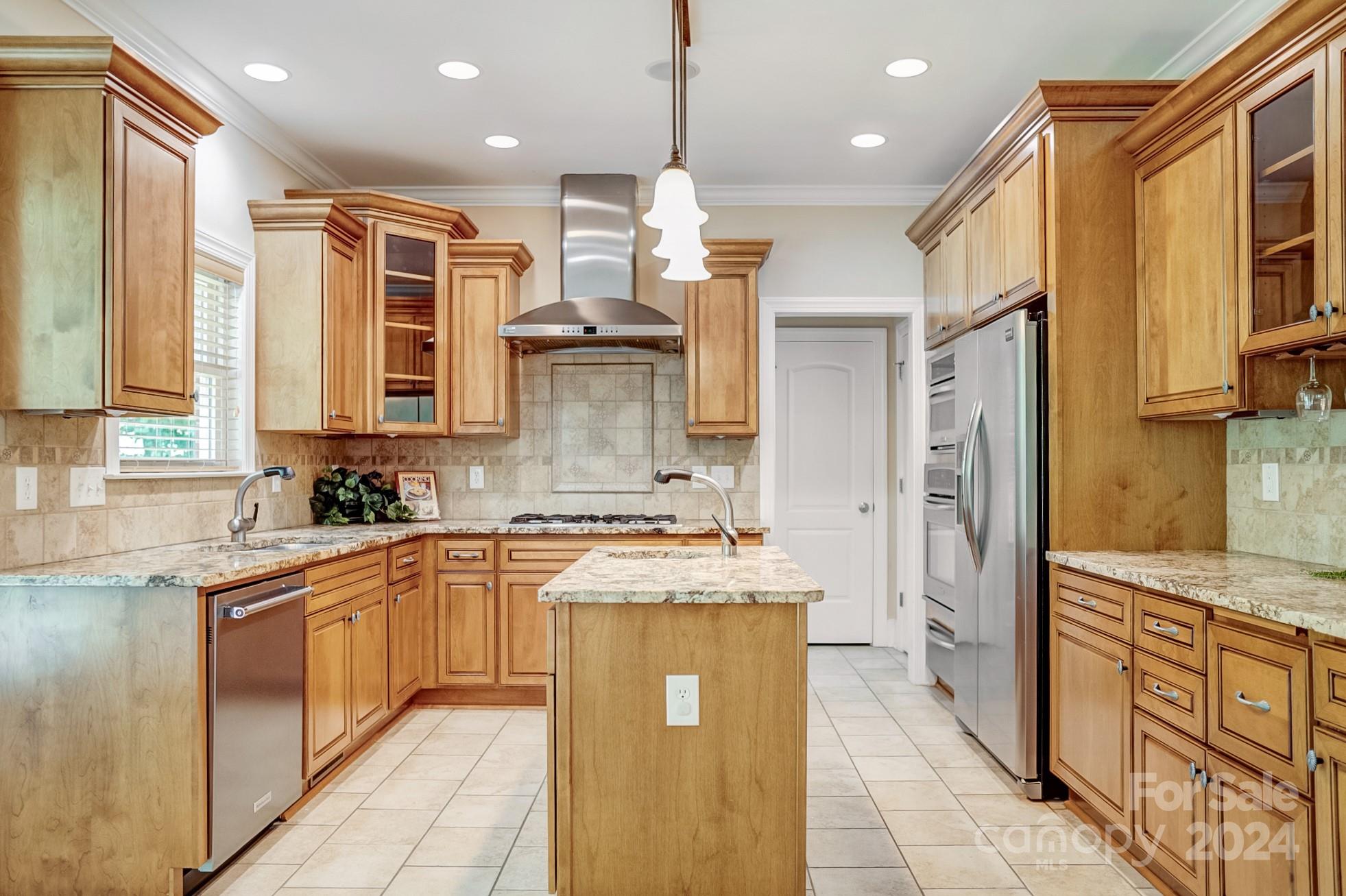 693 Normandy Road Mooresville, NC 28117 - Photo 18 of 48 a kitchen with stainless steel appliances granite countertop a sink and cabinets