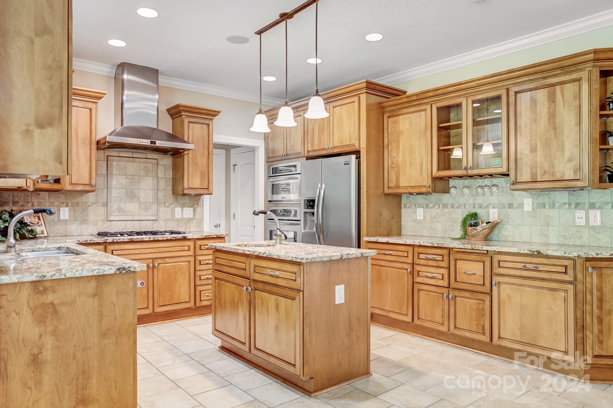 693 Normandy Road Mooresville, NC 28117 - Photo 19 of 48 a kitchen with stainless steel appliances granite countertop a sink a stove and a refrigerator