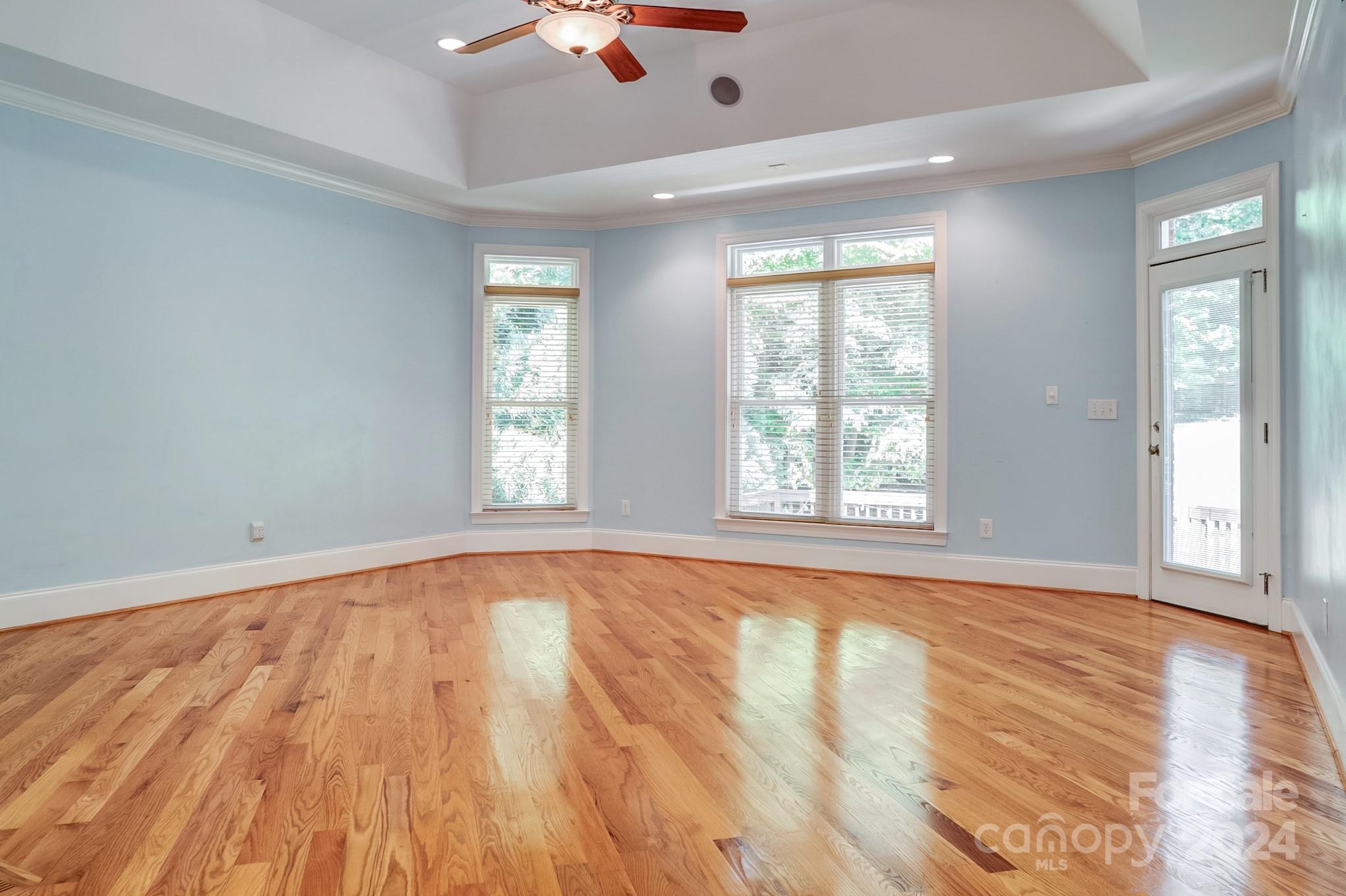 693 Normandy Road Mooresville, NC 28117 - Photo 24 of 48 an empty room with wooden floor and windows