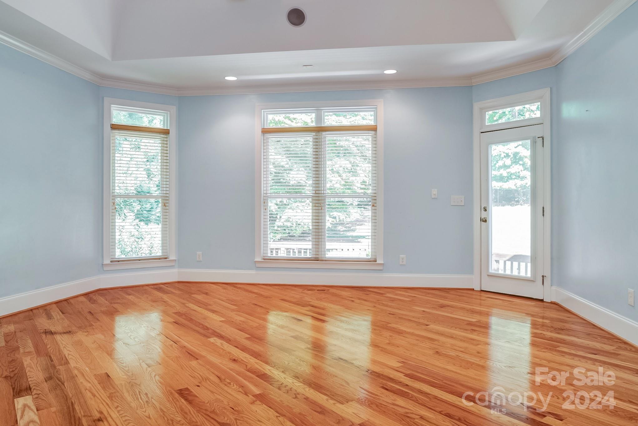 693 Normandy Road Mooresville, NC 28117 - Photo 25 of 48 a view of an empty room with wooden floor and a window