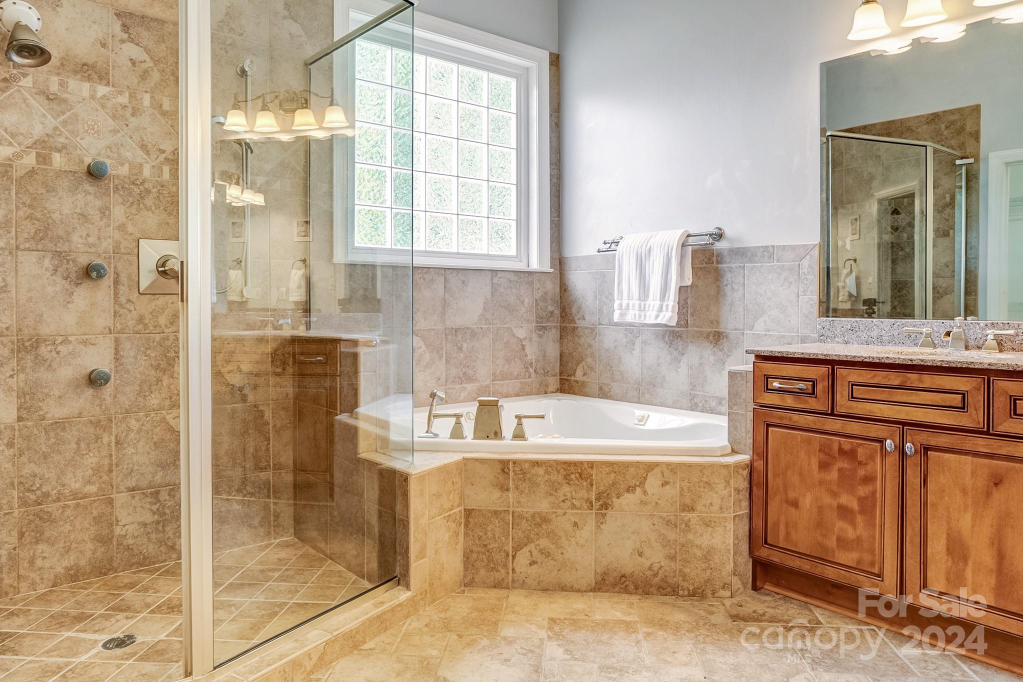 693 Normandy Road Mooresville, NC 28117 - Photo 28 of 48 a bath tub sitting next to a bathroom sink