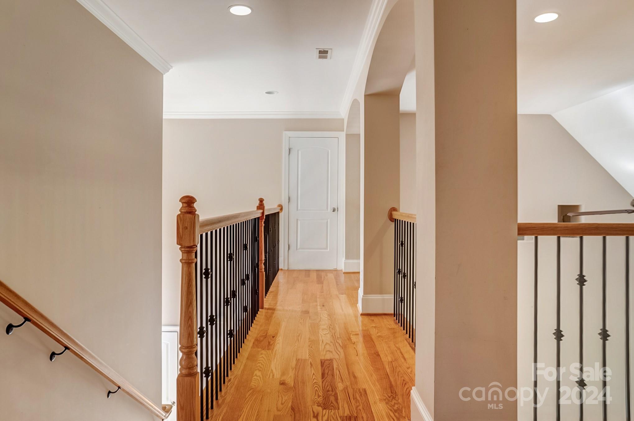 693 Normandy Road Mooresville, NC 28117 - Photo 30 of 48 a view of a hallway with wooden floor and staircase