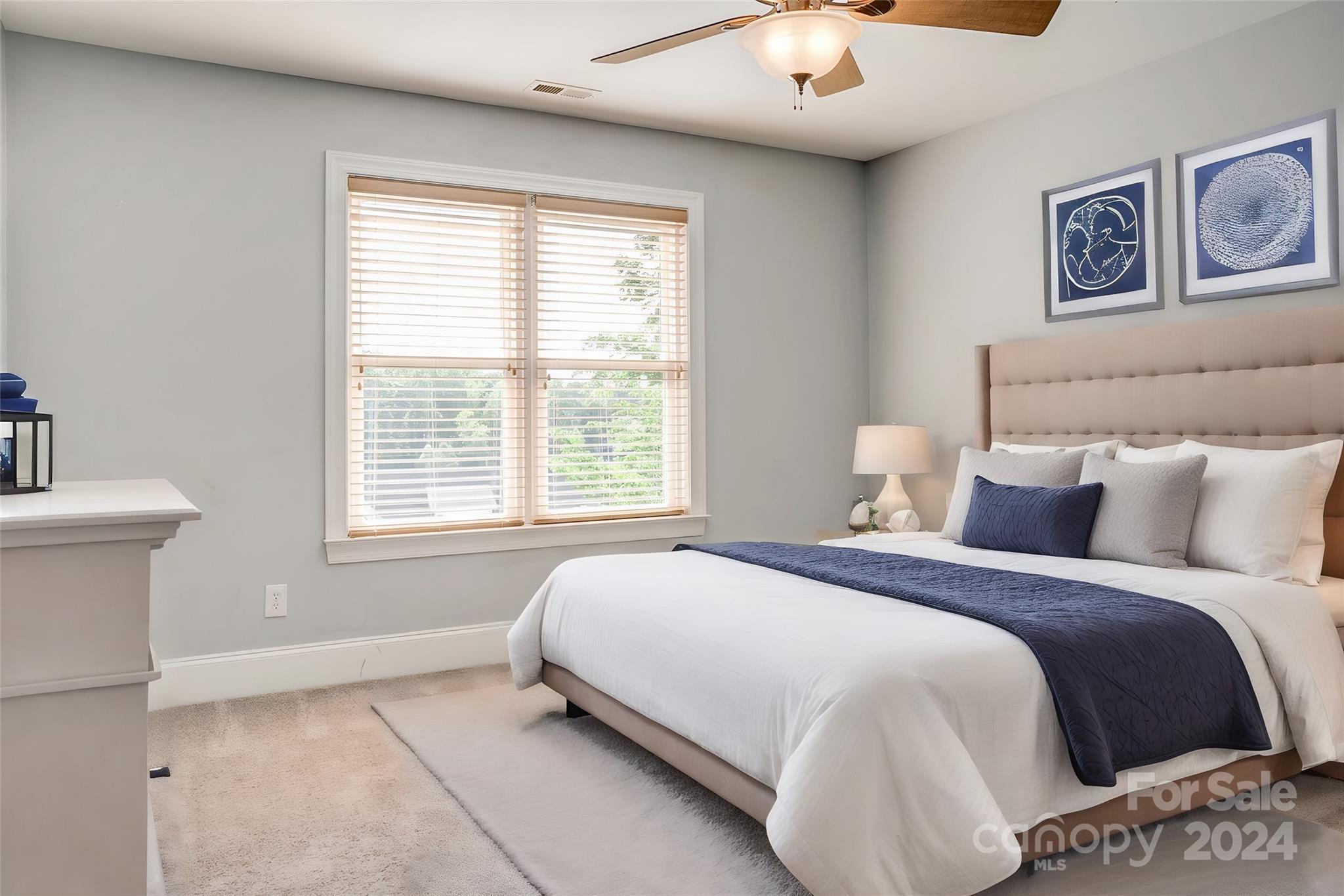 693 Normandy Road Mooresville, NC 28117 - Photo 32 of 48 a spacious bedroom with a bed and window