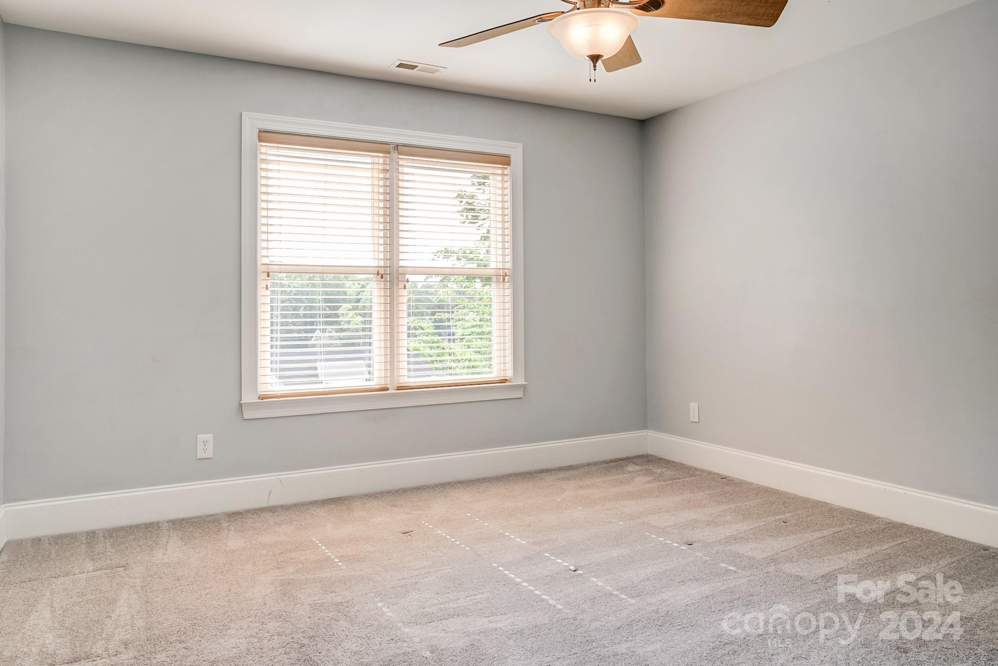 693 Normandy Road Mooresville, NC 28117 - Photo 33 of 48 an empty room with a window