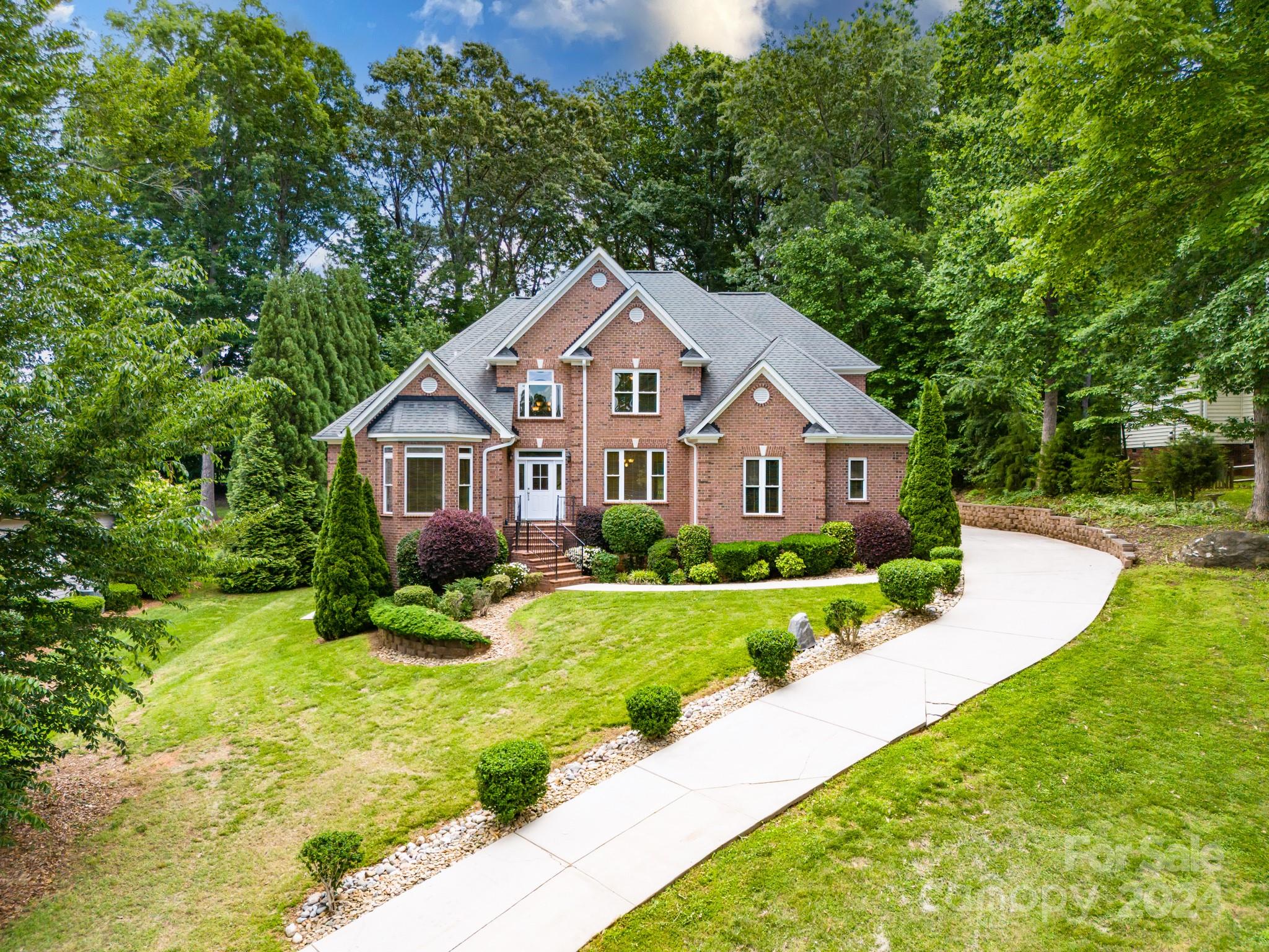 693 Normandy Road Mooresville, NC 28117 - Photo 44 of 48 a front view of a house with yard and green space