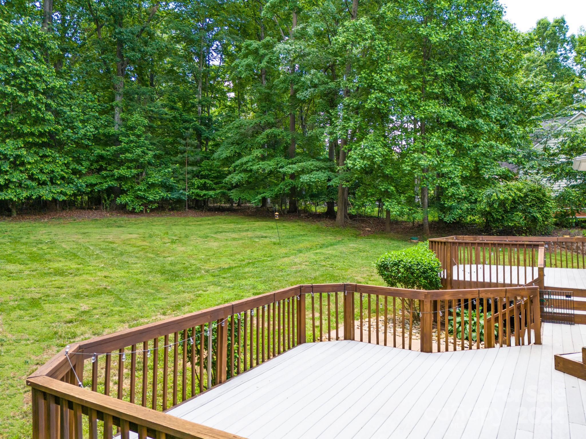 693 Normandy Road Mooresville, NC 28117 - Photo 46 of 48 a view of a wooden deck with a backyard