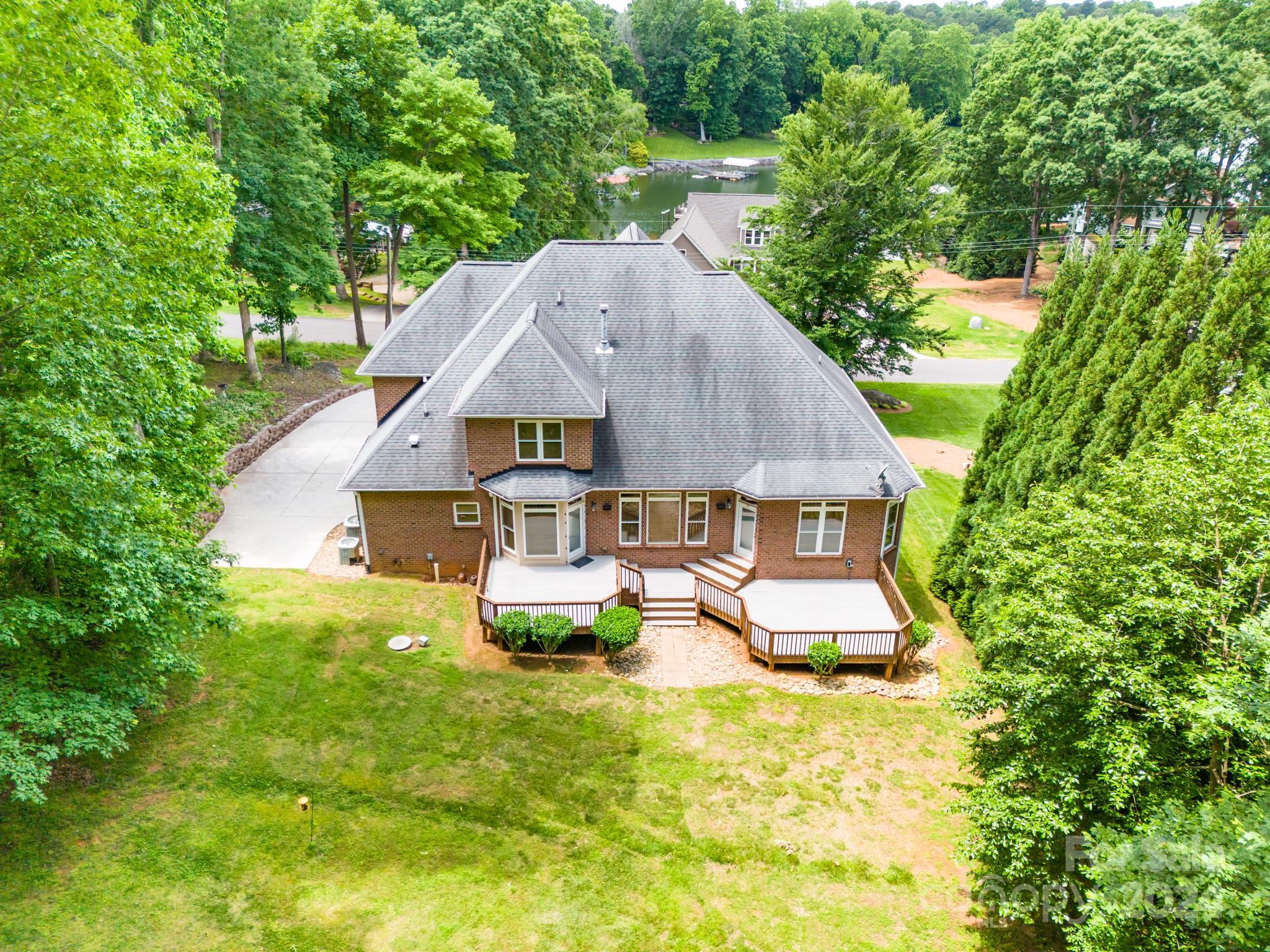 693 Normandy Road Mooresville, NC 28117 - Photo 48 of 48 a aerial view of a house with swimming pool next to a big yard