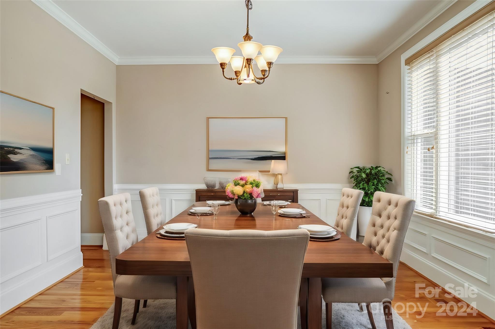 693 Normandy Road Mooresville, NC 28117 - Photo 8 of 48 a dining room with furniture a large window and a chandelier