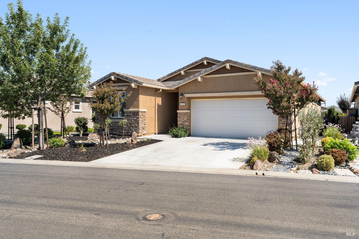 590 Belvedere Drive Rio Vista, CA 94571 - Photo 1 of 63 a front view of a house with a yard and garage