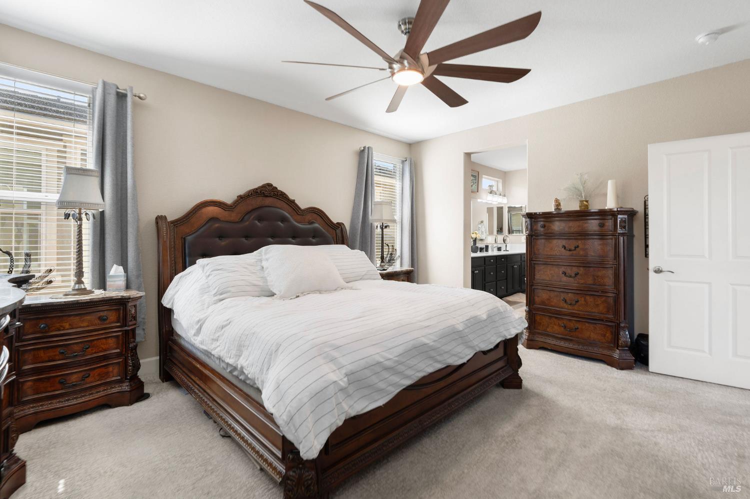 590 Belvedere Drive Rio Vista, CA 94571 - Photo 17 of 63 a large bed sitting in a bedroom and chandelier