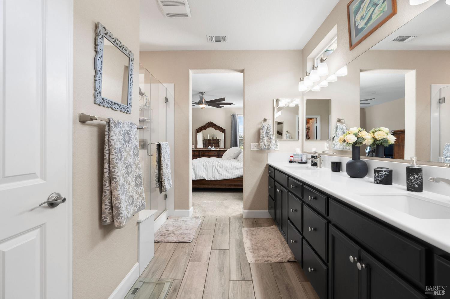590 Belvedere Drive Rio Vista, CA 94571 - Photo 20 of 63 a en suite spacious bathroom with a double vanity sink a mirror and shower