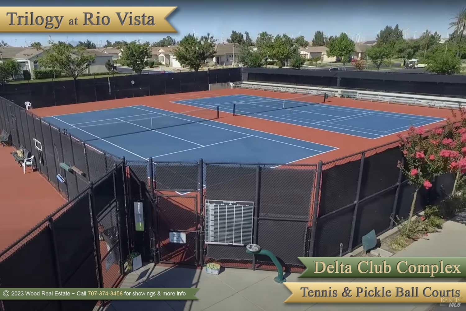 590 Belvedere Drive Rio Vista, CA 94571 - Photo 63 of 63 a view of a tennis court with a bench in the patio