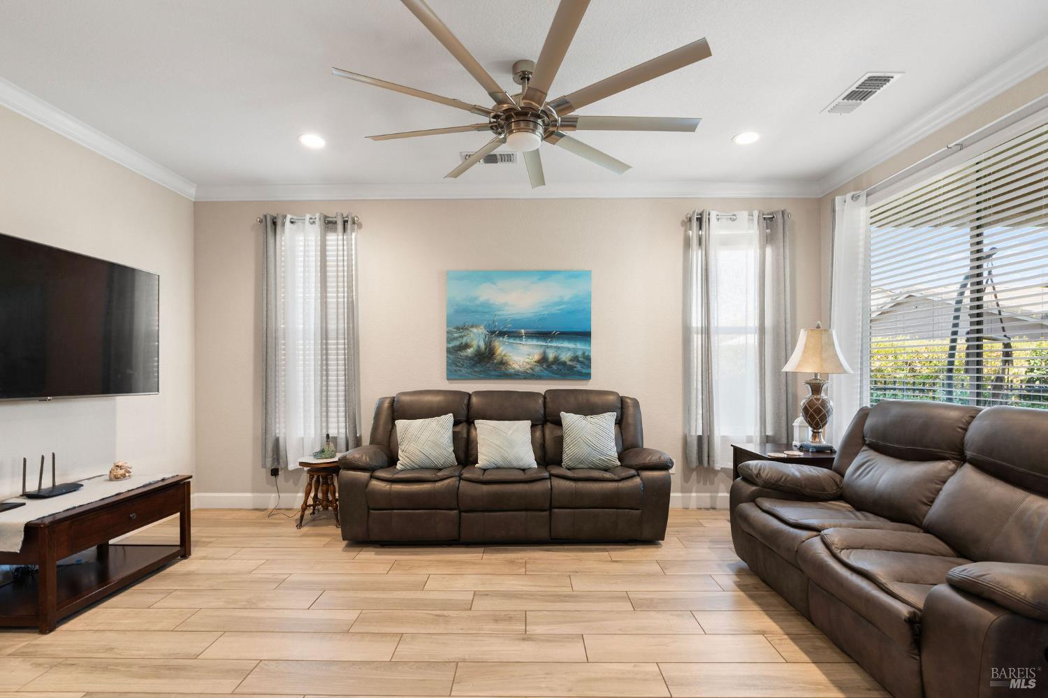 590 Belvedere Drive Rio Vista, CA 94571 - Photo 8 of 63 a living room with furniture and a flat screen tv