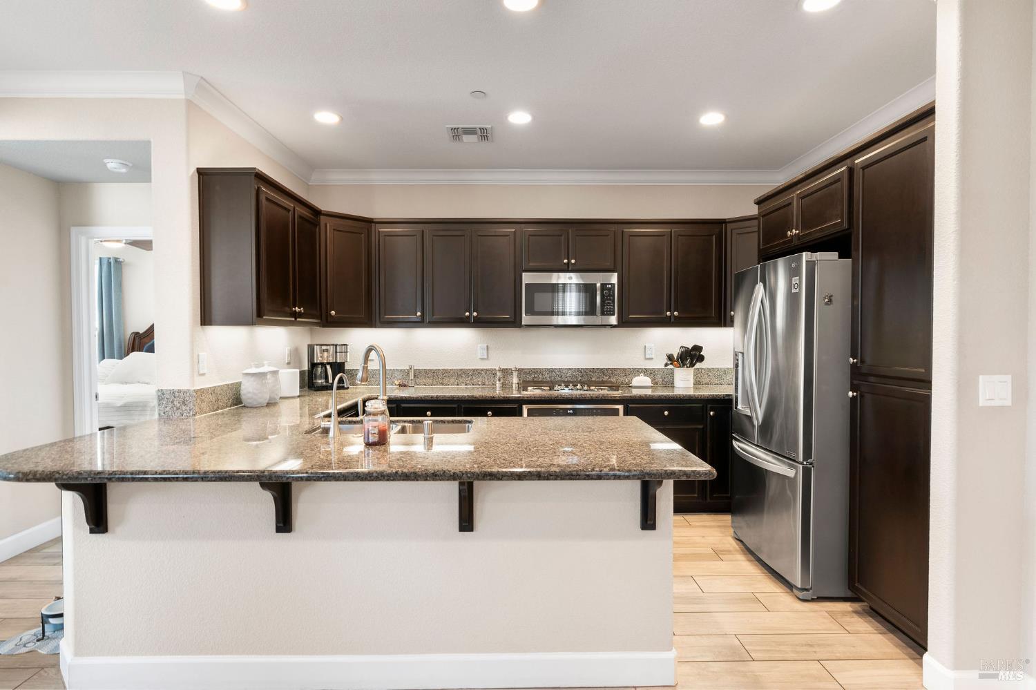 590 Belvedere Drive Rio Vista, CA 94571 - Photo 9 of 63 a kitchen with stainless steel appliances granite countertop a refrigerator stove microwave and sink
