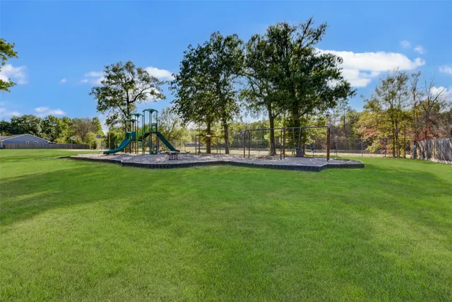 a view of a park with large trees